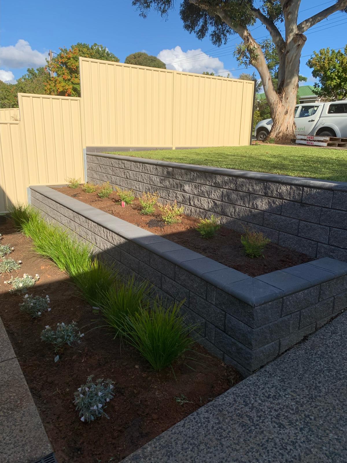 Earthbound landscaping retaining walls grass lawn installation