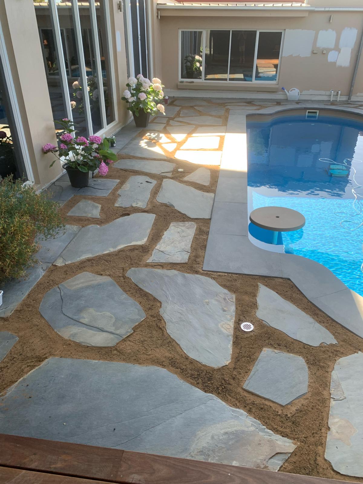 Earthbound landscaping pool paving